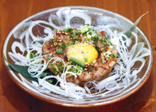 Meatballs served with egg yolk