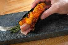 Hand-rolled sea urchin and salmon roe sushi