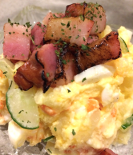 Potato salad topped with bacon