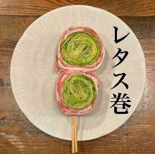 Grilled pork wrapped lettuce skewer