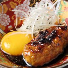 Meatballs served with egg yolk