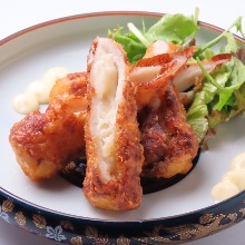 Deep-fried chikuwa (tube-shaped fish paste cake) stuffed with potato salad