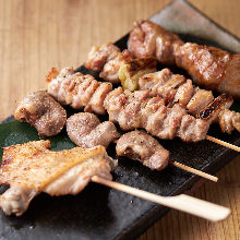 Assorted grilled chicken skewers