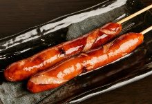 Grilled wiener sausage and bacon skewer