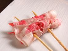 Grilled meat-wrapped ginger skewer