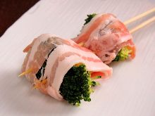 Seared pork wrapped vegetable skewer