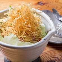 Salad topped with crispy fried noodles