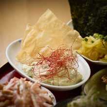 Shrimps and avocado tartar on pao de queijo