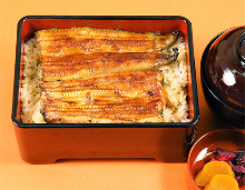 Premium eel served over rice in a lacquered box