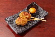 Meatballs served with egg yolk