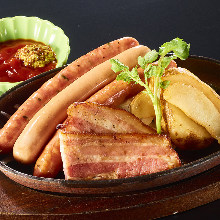 Assorted charcoal grilled sausages and bacon