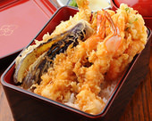 Tempura served over rice in a lacquered box