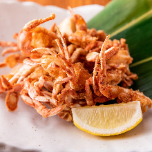 Fried crab claw meat skewer