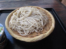 Buckwheat noodles served on a bamboo strainer