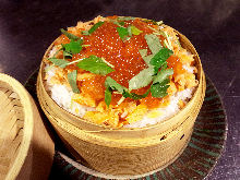 Steamed rice with toppings in wooden steamer