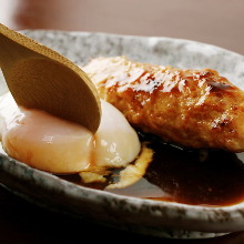 Meatballs served with egg yolk