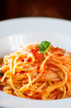 Pasta with tomato sauce, mozzarella, and basil