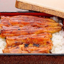 Premium eel served over rice in a lacquered box