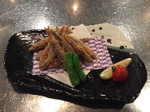 Fried silver-stripe round herring