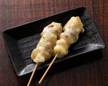 Grilled pork-wrapped mochi skewer