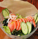 Salad topped with crispy fried noodles