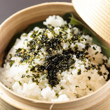 Steamed rice with toppings in wooden steamer (Perilla,Wakame)