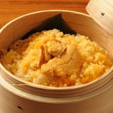 Steamed rice with toppings in wooden steamer