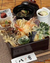 Tempura served over rice in a lacquered box