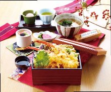 Tempura served over rice in a lacquered box meal set