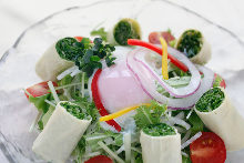 Mizuna salad topped with slow-poached egg