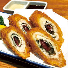 Fried chicken wrapped in perilla leaf skewer