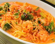 Tomato cream sauce pasta with shrimp and spinach