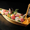 Whole fish sashimi arranged in the original shape served in boat-like-plate