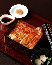 Premium eel served over rice in a lacquered box