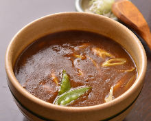 Buckwheat noodles with curry sauce and scallions