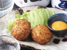 Meatballs served with egg yolk