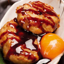 Meatballs served with egg yolk