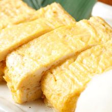 Japanese-style rolled omelet topped with onioroshi (grated vegetable)