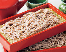 Buckwheat noodles served on a bamboo strainer