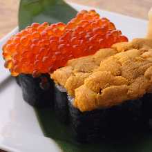sea urchin and salmon roe on the cucumber roll