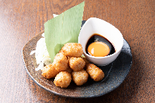 Meatballs served with egg yolk