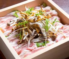 Vegetables and pork steamed in a bamboo steamer