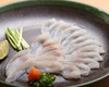 Thinly-sliced blowfish sashimi