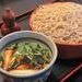 Buckwheat noodles served on a bamboo strainer with duck