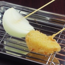 Fried onion skewer