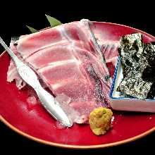Left over flesh on the spine of Tuna sashimi Nori Roll Style