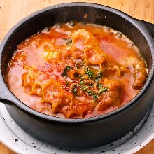 Beef tendon stewed with tomatoes