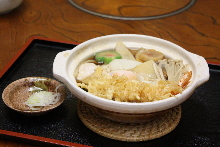 Wheat noodles boiled in a ceramic pot