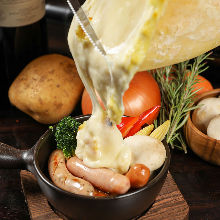 Vegetables topped with raclette cheese