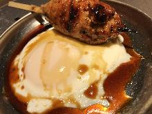 Meatballs served with egg yolk